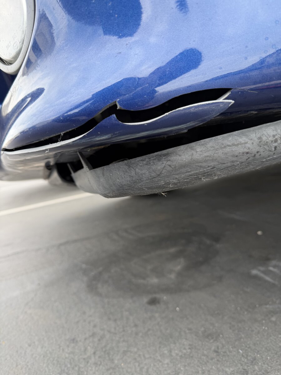 BMW M5 front bumper restored on-site — before