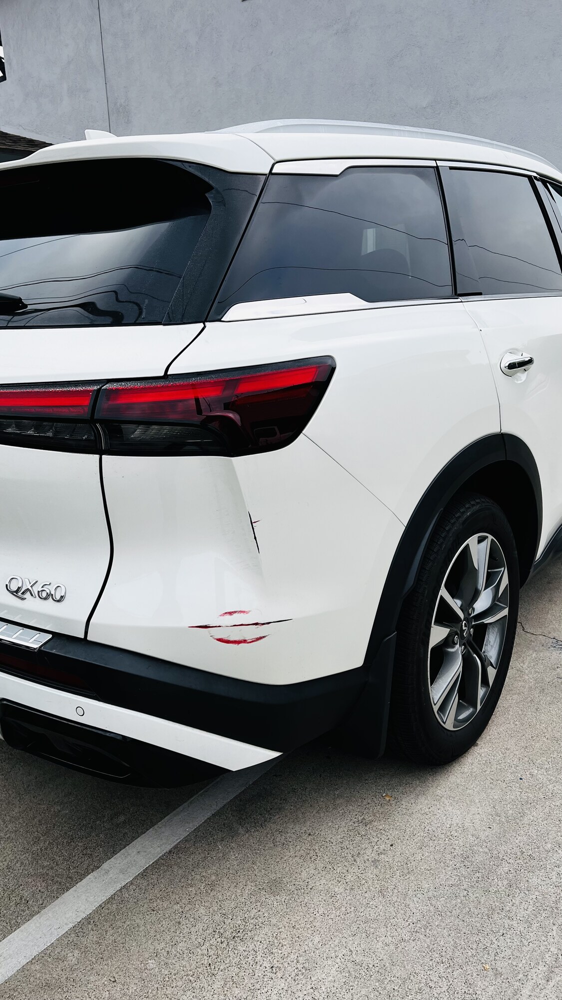 Infiniti QX60 rear bumper scratch fully restored — before