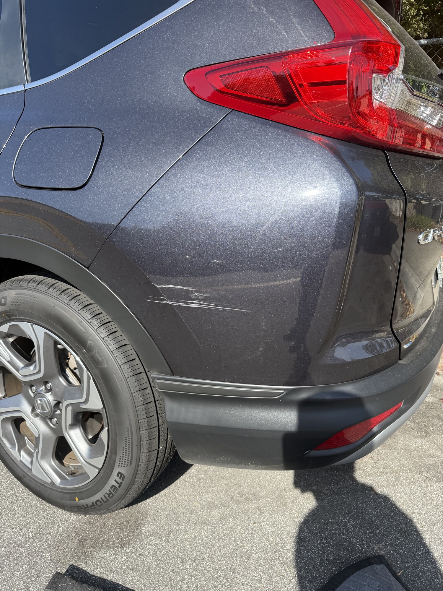 Honda CR-V rear quarter scrape repaired — before